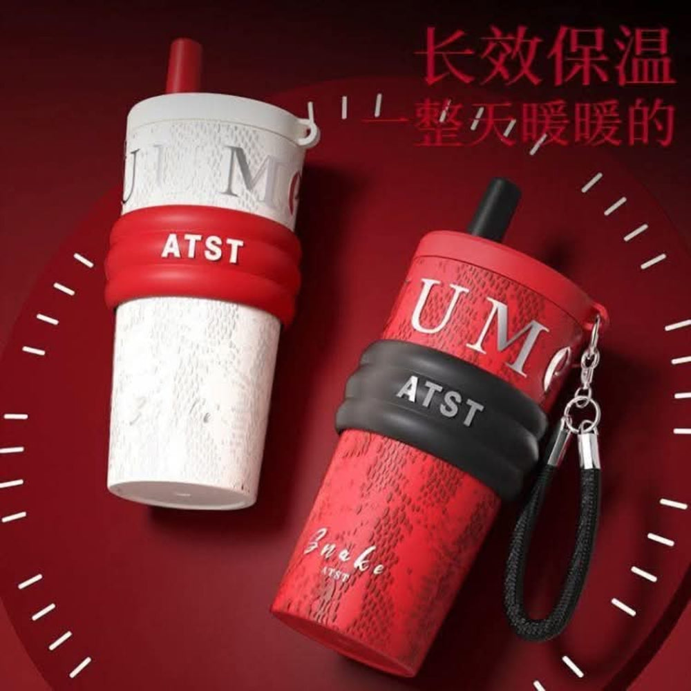 Black water bottle with brand logo on a red background